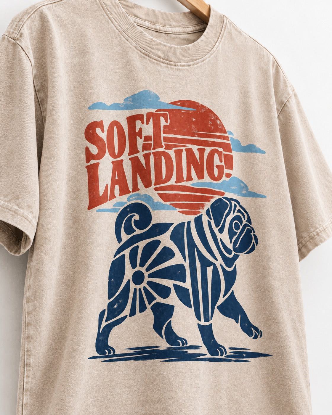 Pug's Soft Landing Washed Tee in Apricot, close-up of the graphic