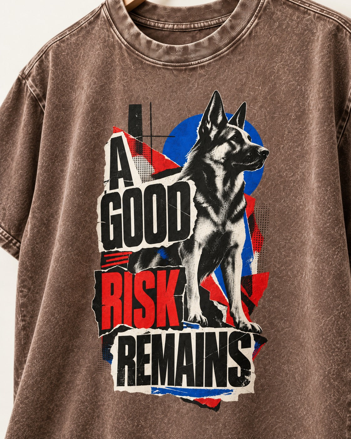 A Good Risk Remains German Shepherd Dog Washed Tee in Coffee, close-up of the graphic