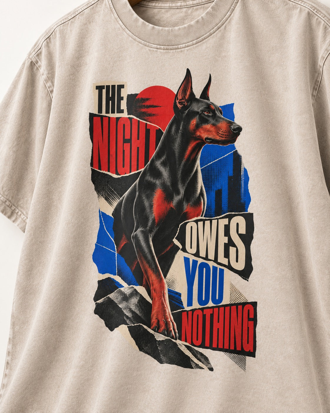 Night Owes You Nothing Doberman Washed Tee in Apricot, close-up of the graphic
