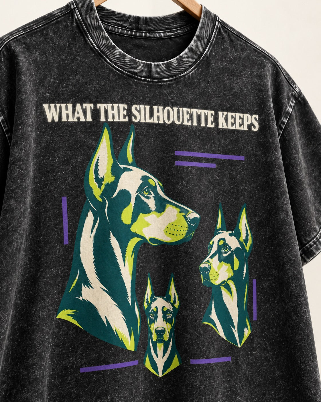 Doberman What the Silhouette Keeps Three Portrait Graphic Washed Tee in Black, close-up of the graphic