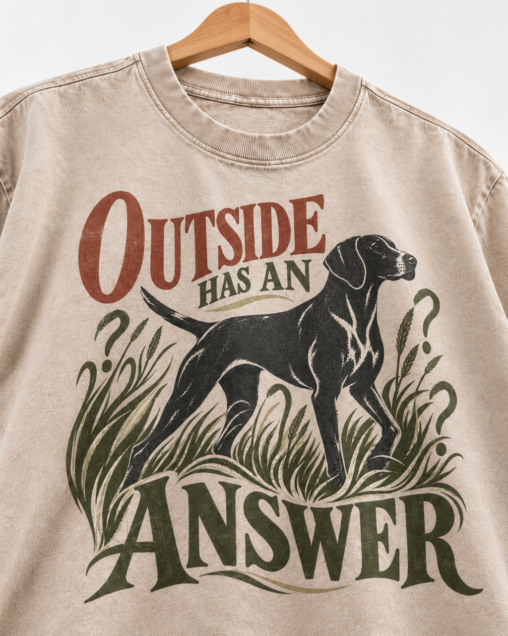 Outside Has an Answer German Shorthaired Pointer Washed Tee in Apricot, close-up of the graphic