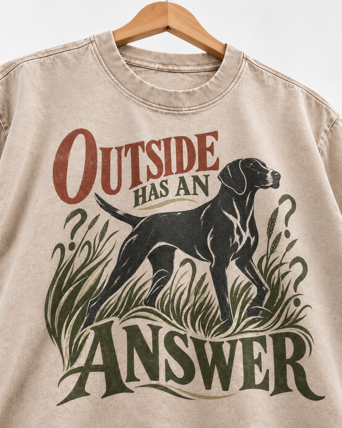 Outside Has an Answer German Shorthaired Pointer Washed Tee in Apricot, close-up of the graphic