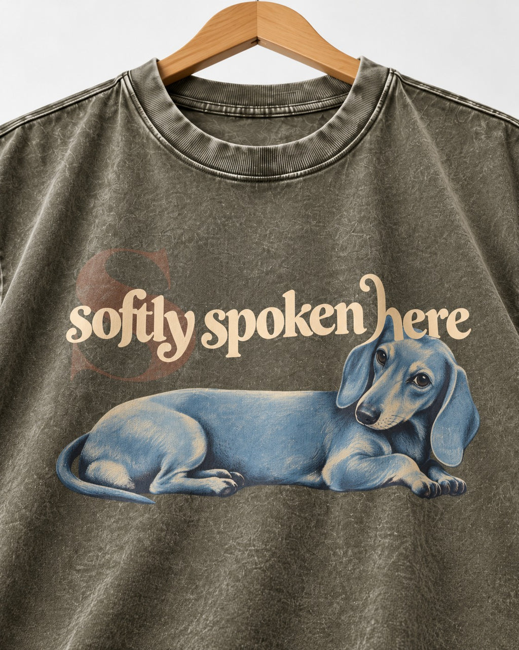 Dachshund Softly Spoken Here Reclining Portrait Graphic Washed Tee in Army Green, close-up of the graphic