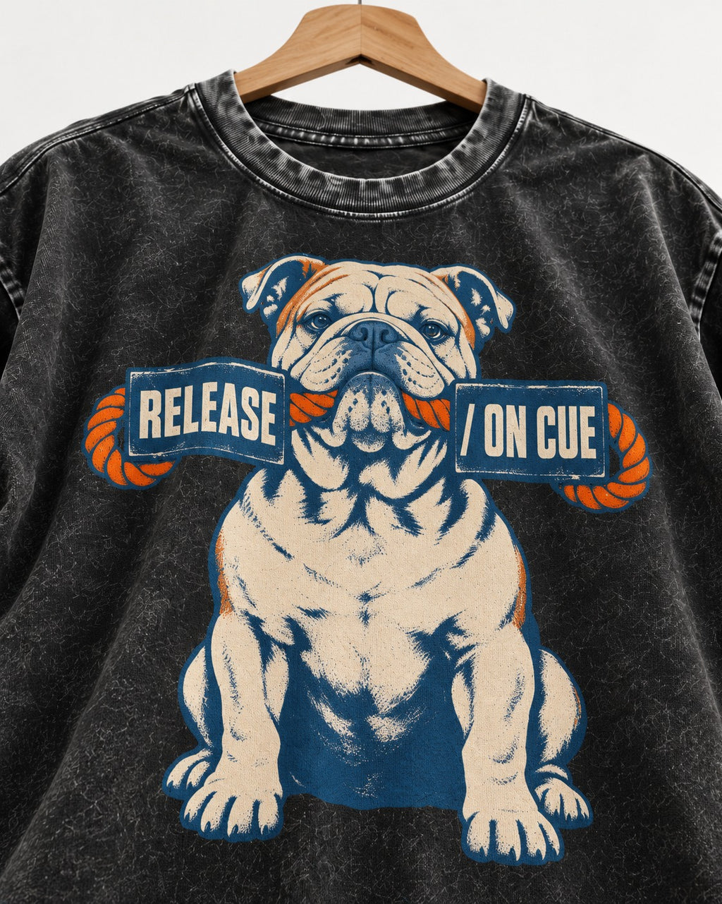English Bulldog Release on Cue Rope Sign Graphic Washed Tee in Black, close-up of the graphic