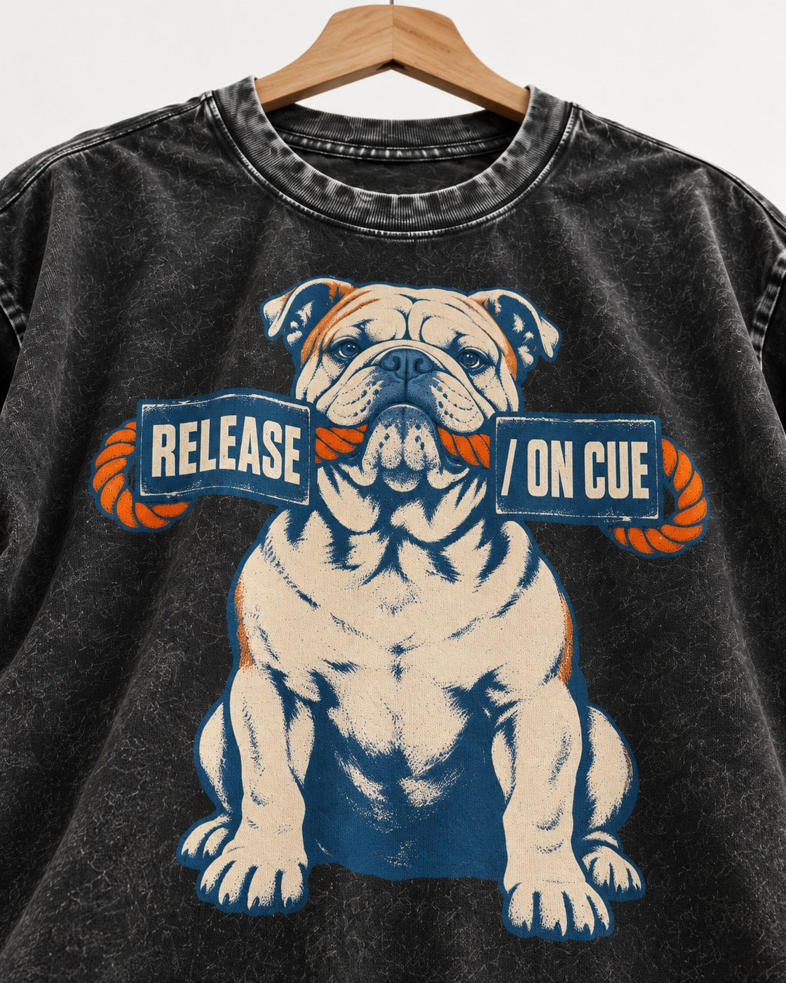 English Bulldog Release on Cue Rope Sign Graphic Washed Tee in Black, close-up of the graphic