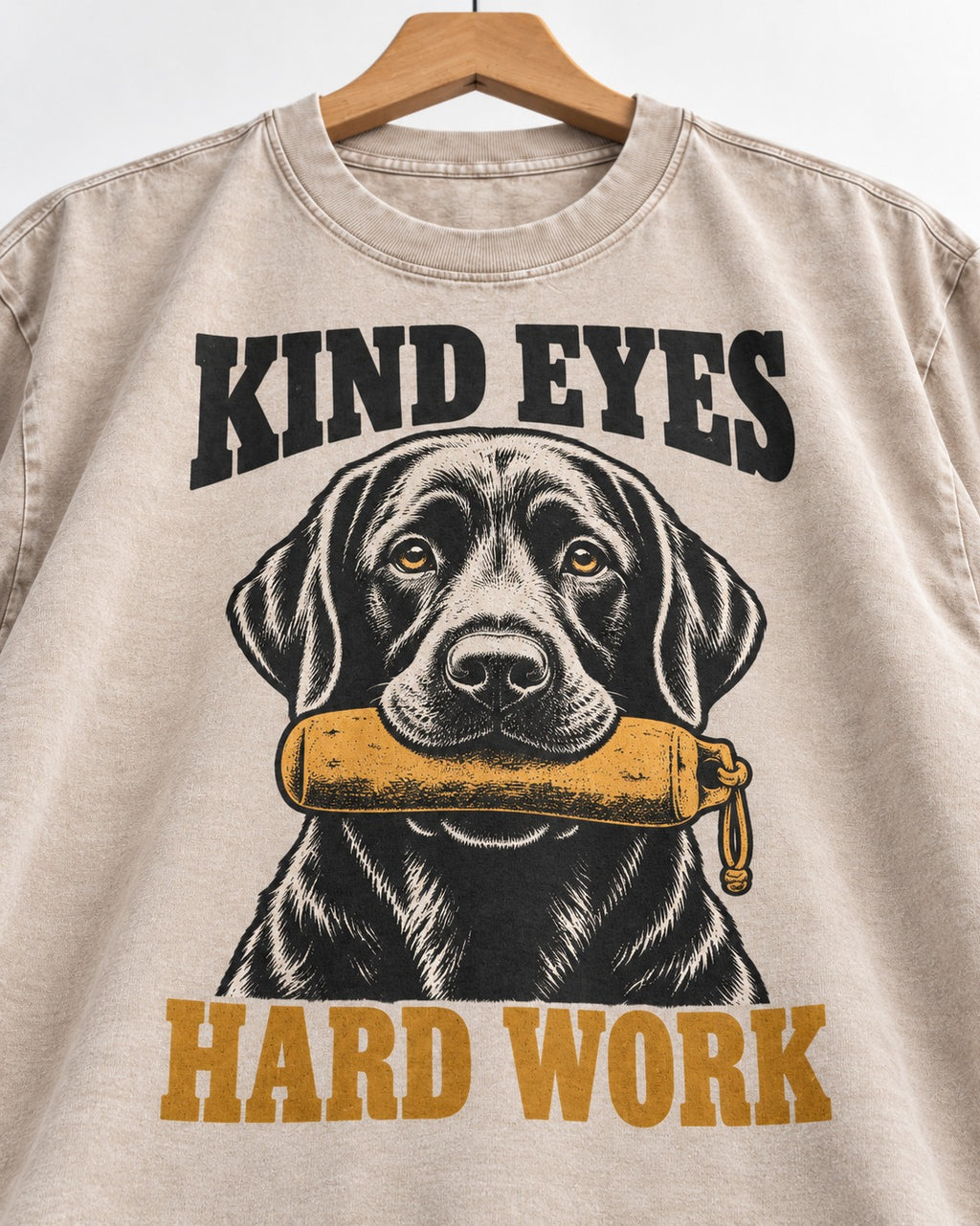 Kind Eyes Hard Work Labrador Retriever Washed Tee in Apricot, close-up of the graphic