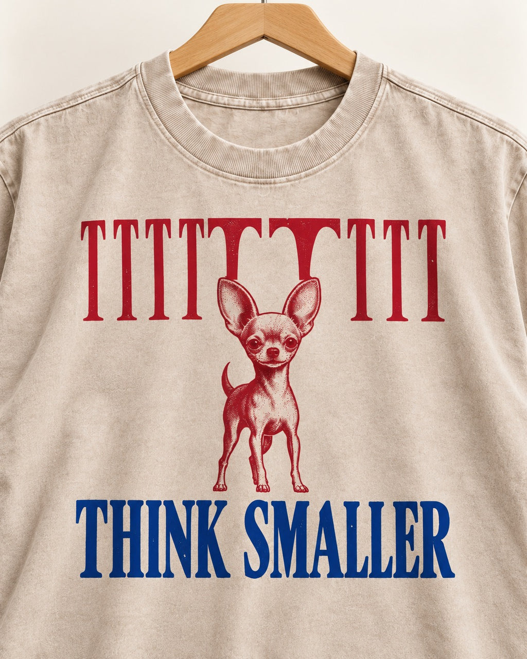 Think Smaller Chihuahua Washed Tee in Apricot, close-up of the graphic