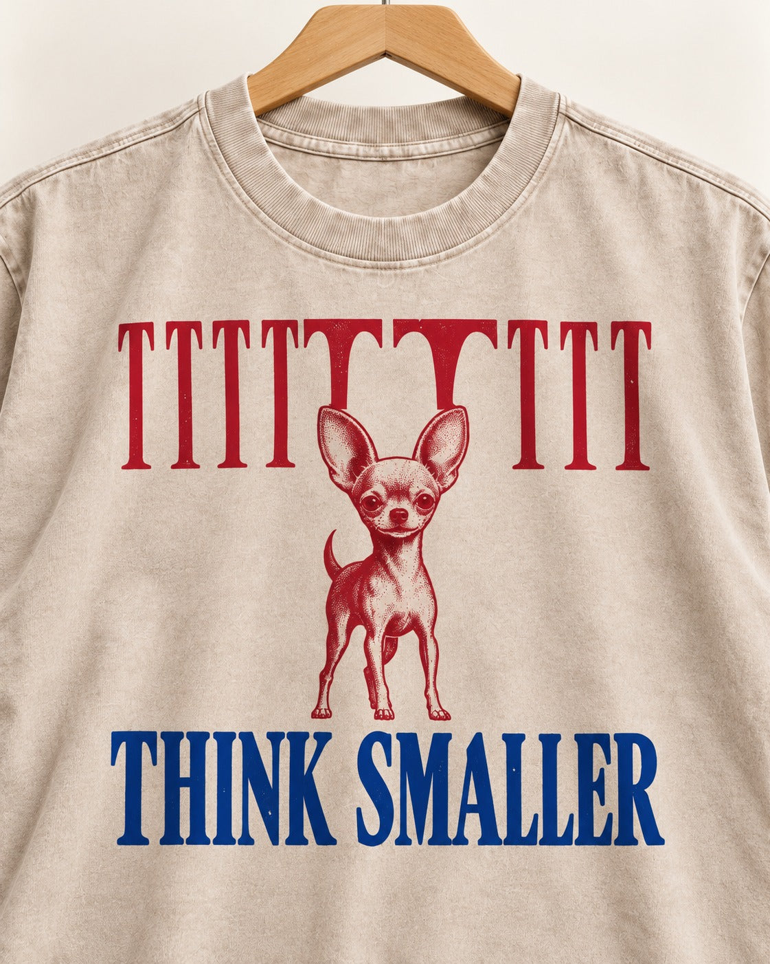 Think Smaller Chihuahua Washed Tee in Apricot, close-up of the graphic