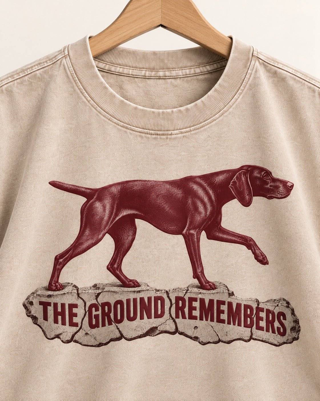 The Ground Remembers German Shorthaired Pointer Washed Tee in Apricot, close-up of the graphic