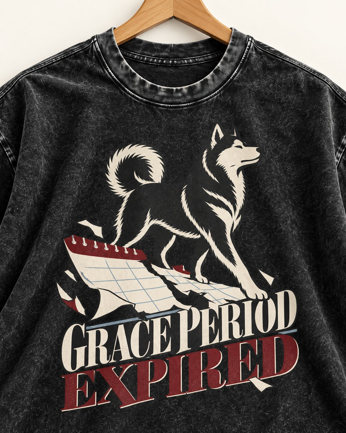 Husky Grace Period Expired Torn Calendar Graphic Washed Tee in Black, close-up of the graphic