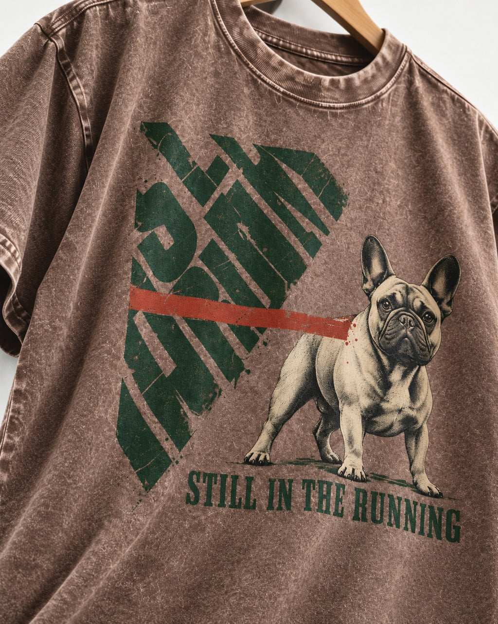 Frenchie Still in the Running Washed Tee in Coffee, close-up of the graphic