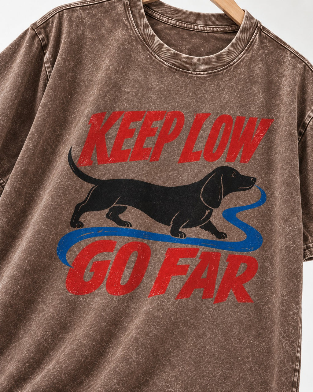 Keep Low Go Far Dachshund Washed Tee in Coffee, close-up of the graphic