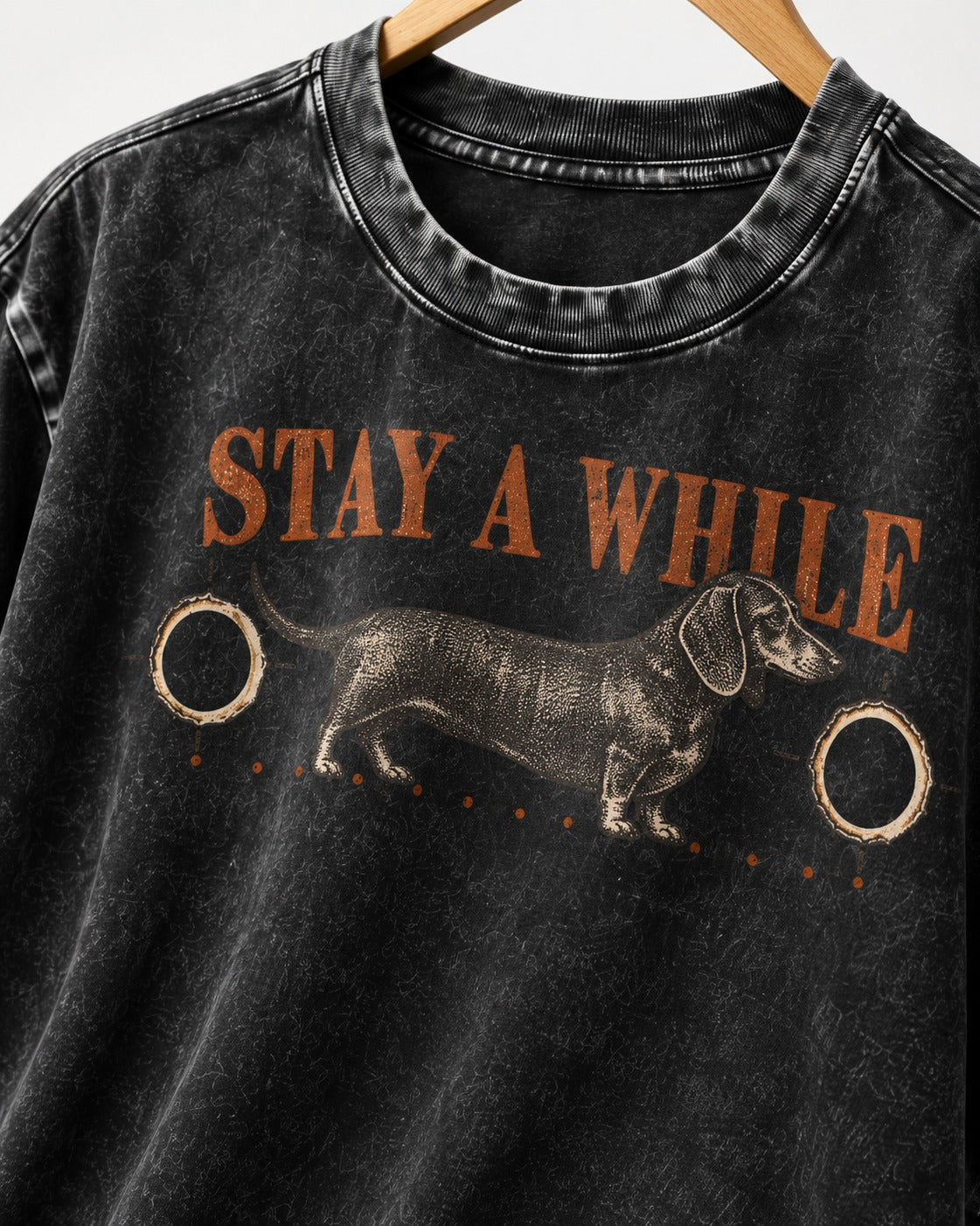 Dachshund Stay A While Ornamental Portrait Graphic Washed Tee in Black, close-up of the graphic