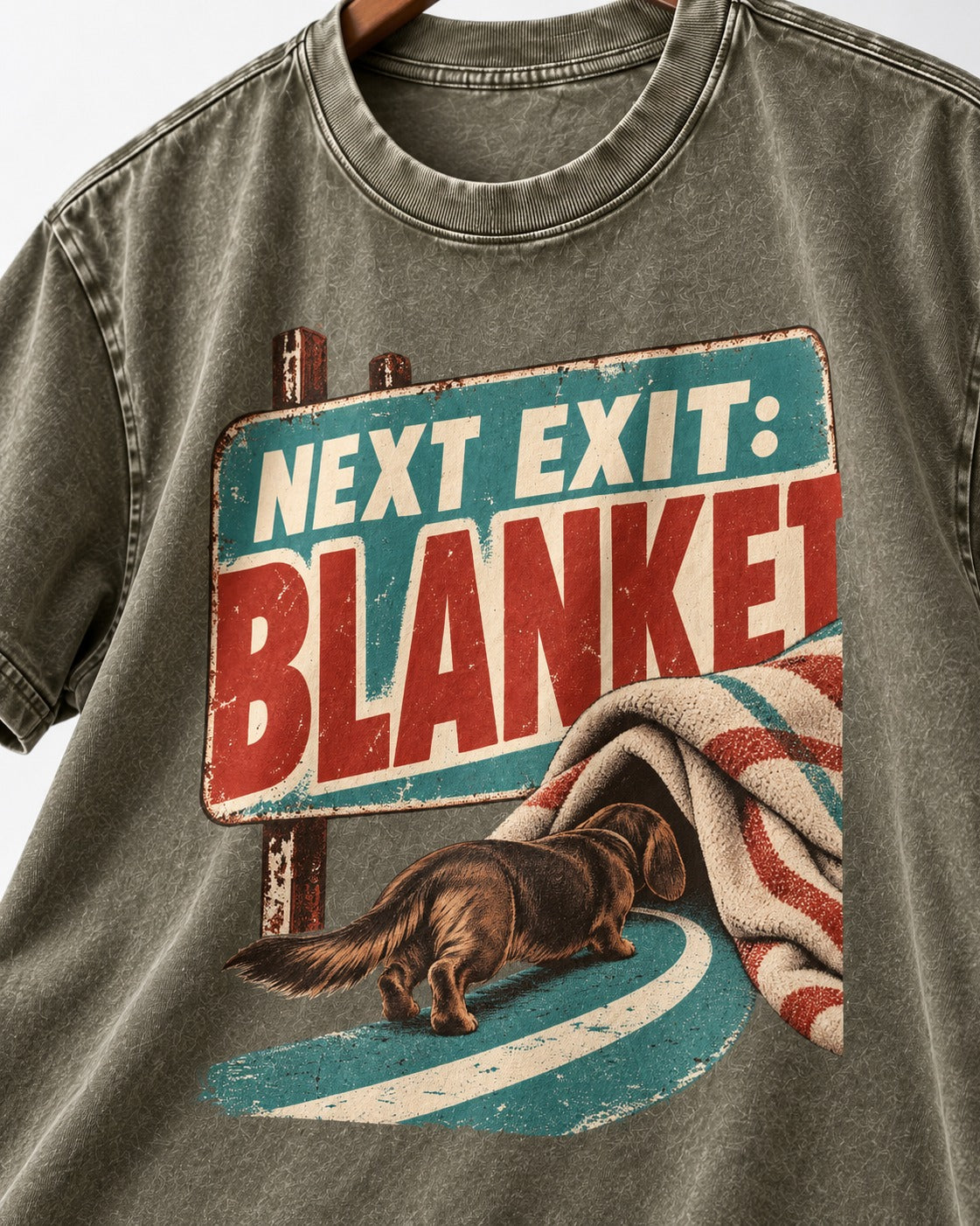 Dachshund Next Exit Blanket Road Sign Graphic Washed Tee in Army Green, close-up of the graphic