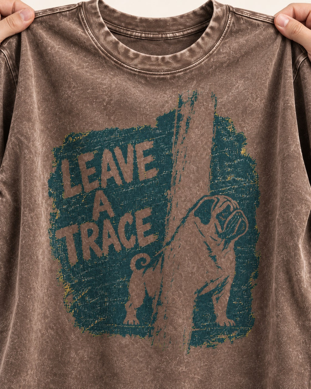 Pug Leaves a Trace Washed Tee in Coffee, close-up of the graphic