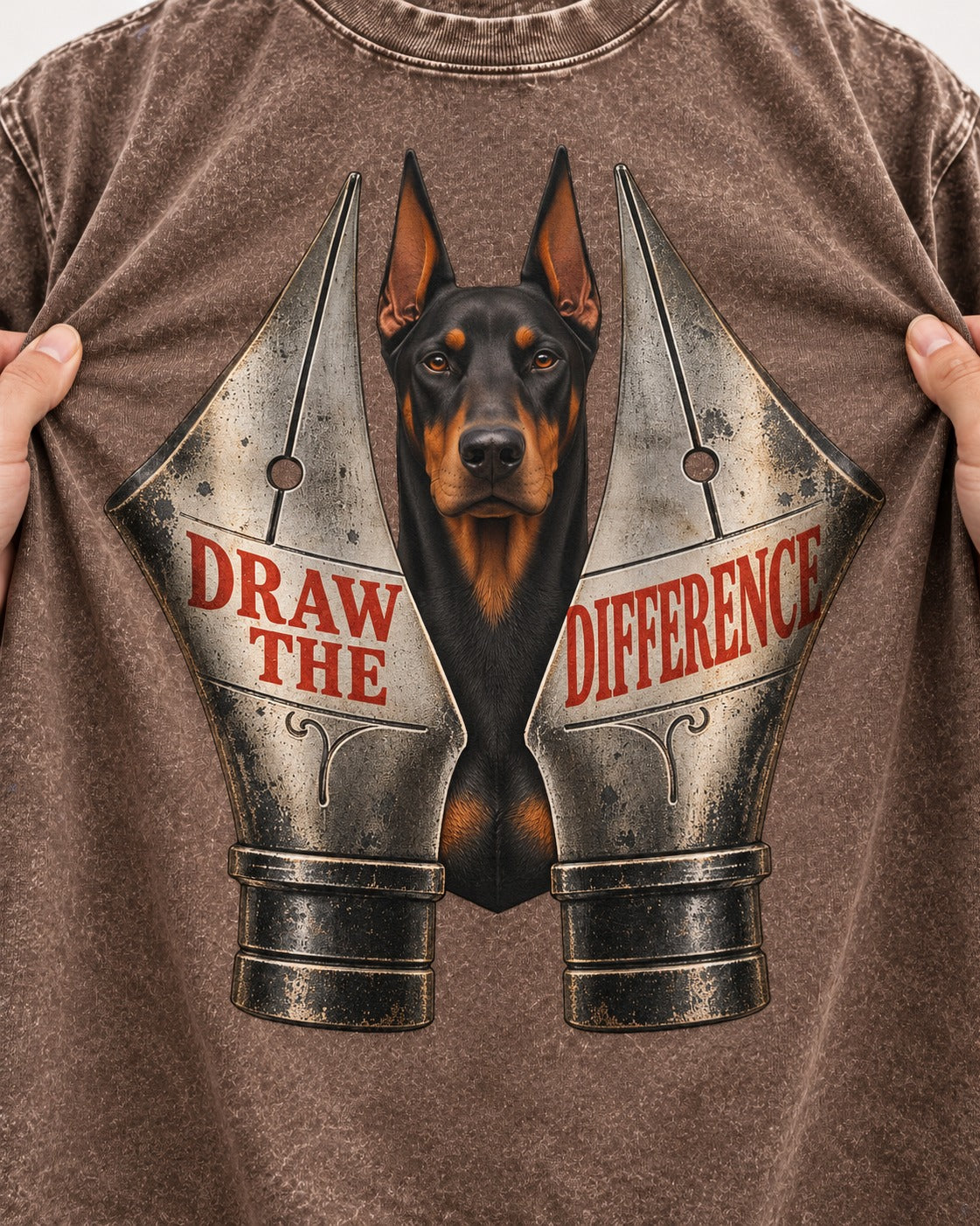 Doberman Draw the Difference Washed Tee in Coffee, close-up of the graphic