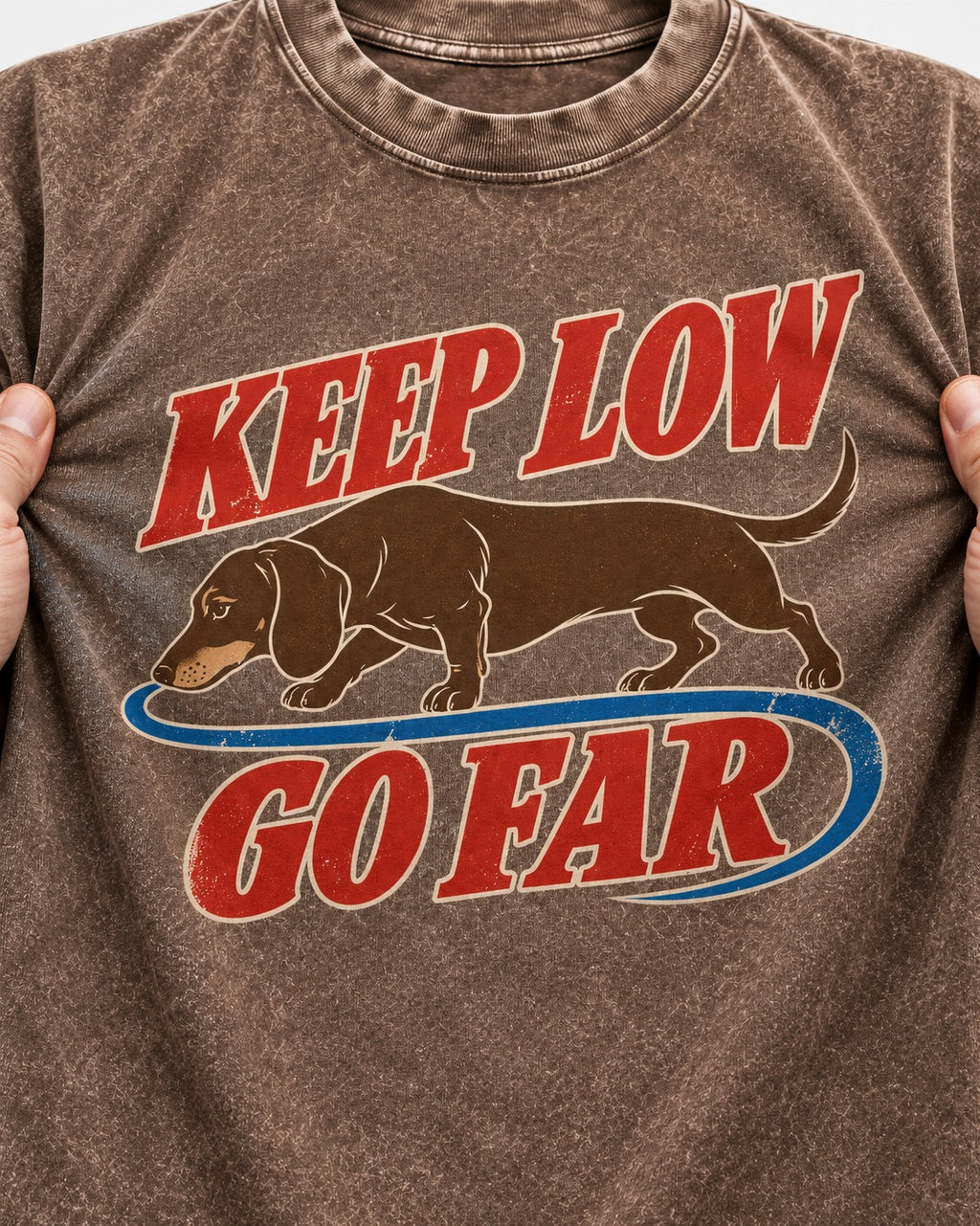 Dachshund Keep Low Go Far Washed Tee in Coffee, close-up of the graphic