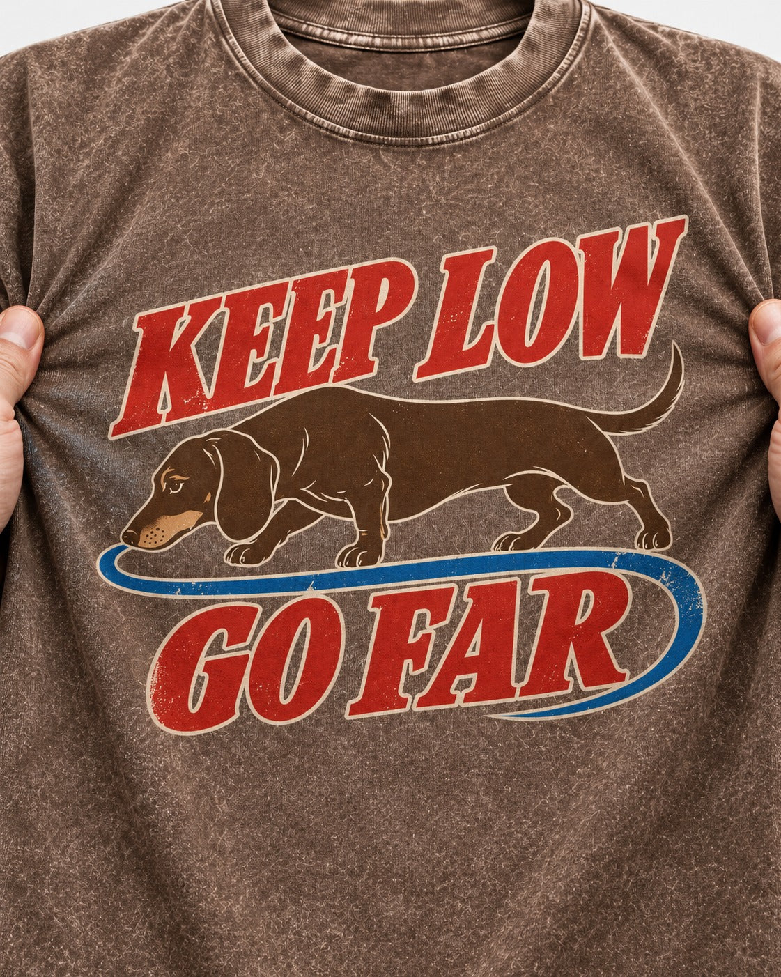Dachshund Keep Low Go Far Washed Tee in Coffee, close-up of the graphic