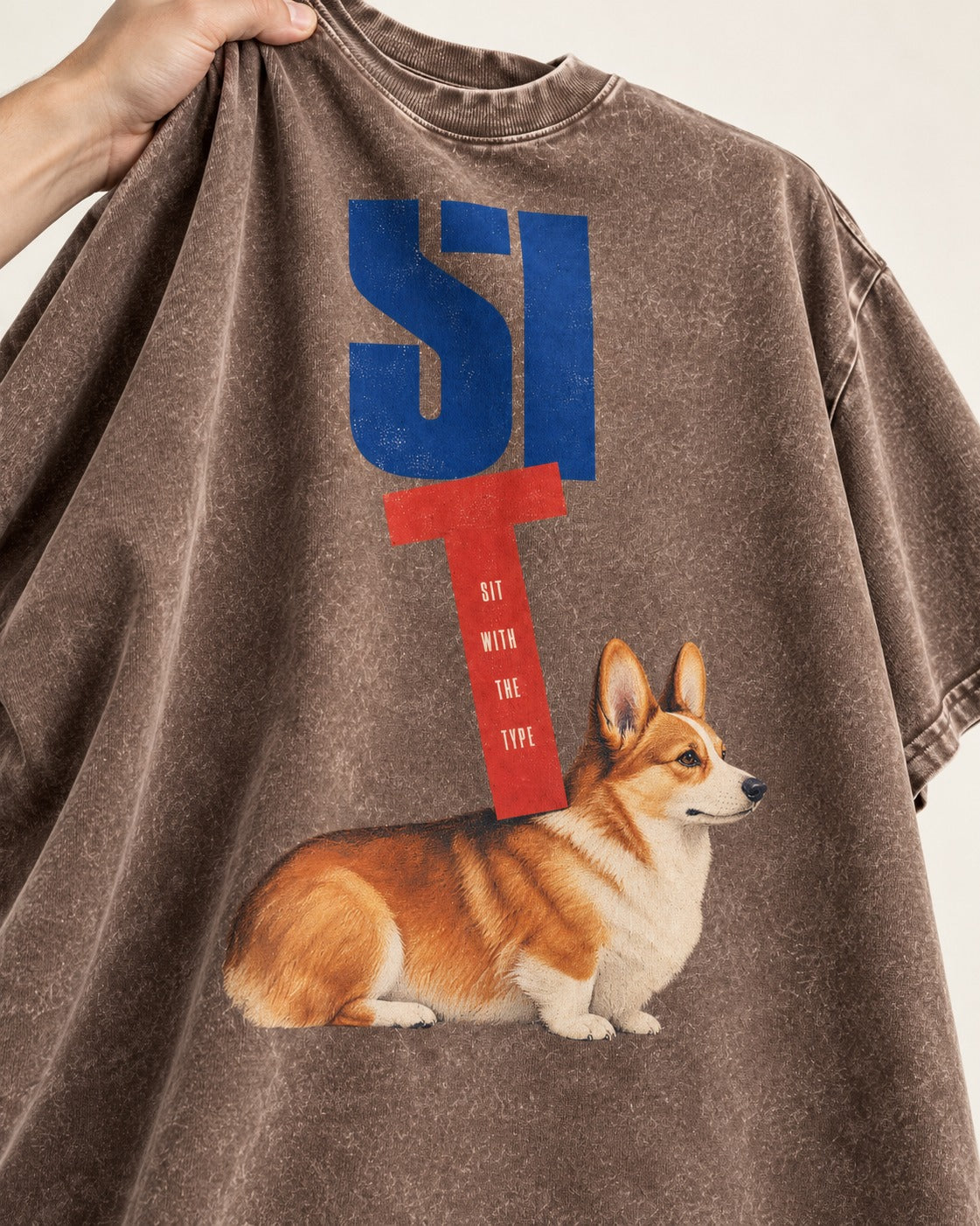 Sit with the Corgi Washed Tee in Coffee, close-up of the graphic