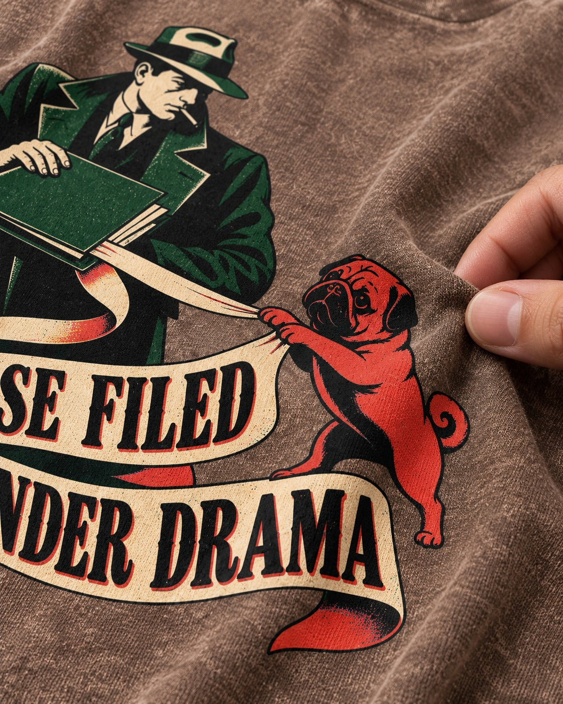Pug Case Filed Under Drama Washed Tee in Coffee, close-up of the graphic