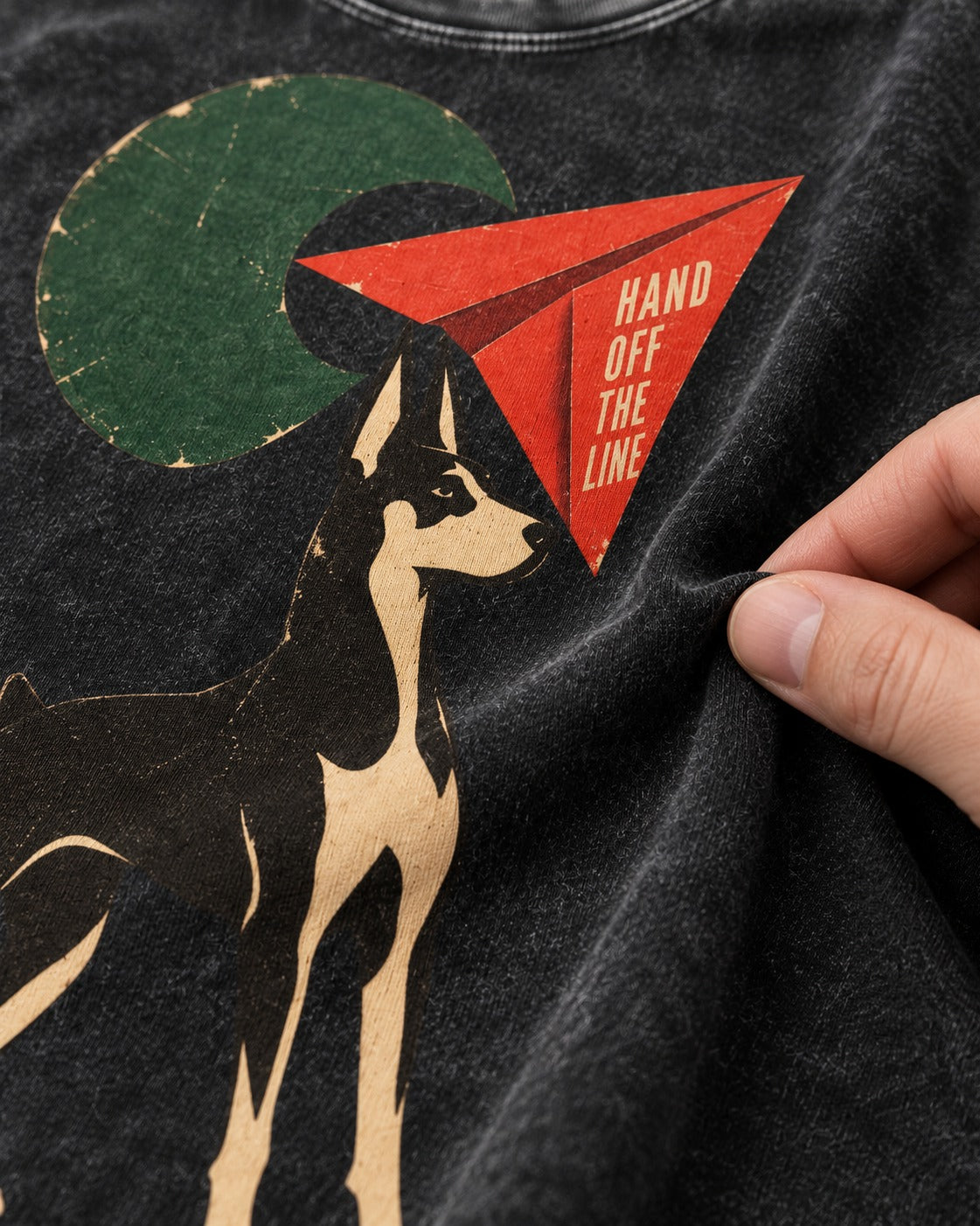 Doberman Hand Off the Line Paper Plane Graphic Washed Tee in Black, close-up of the graphic