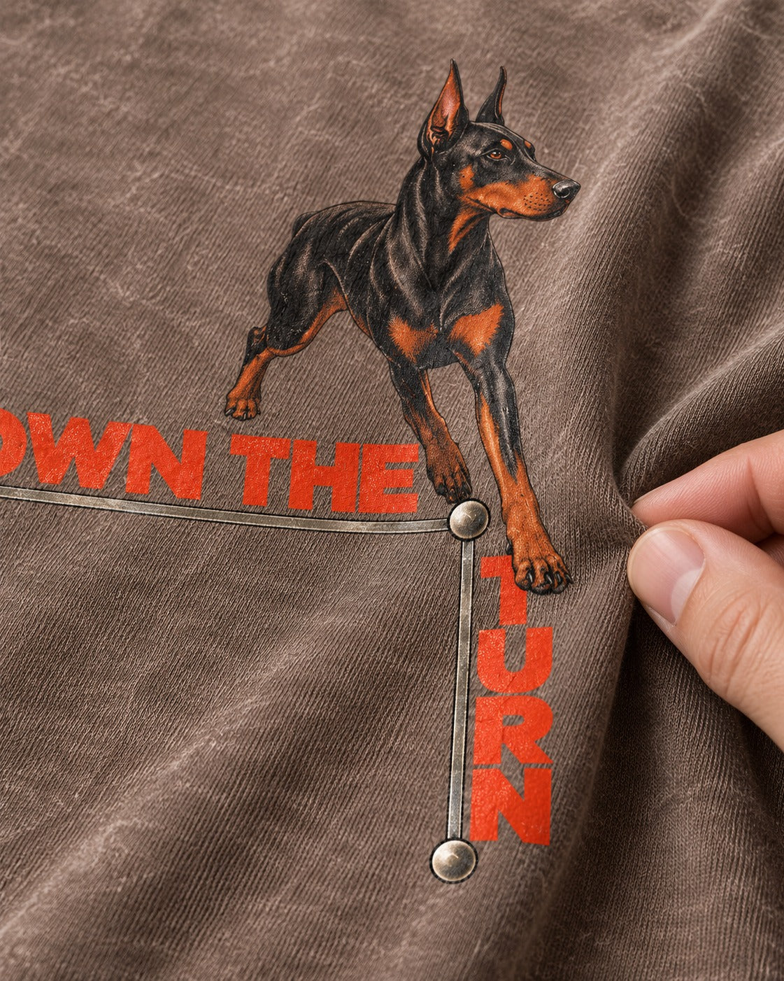 Own the Turn Doberman Washed Tee in Coffee, close-up of the graphic