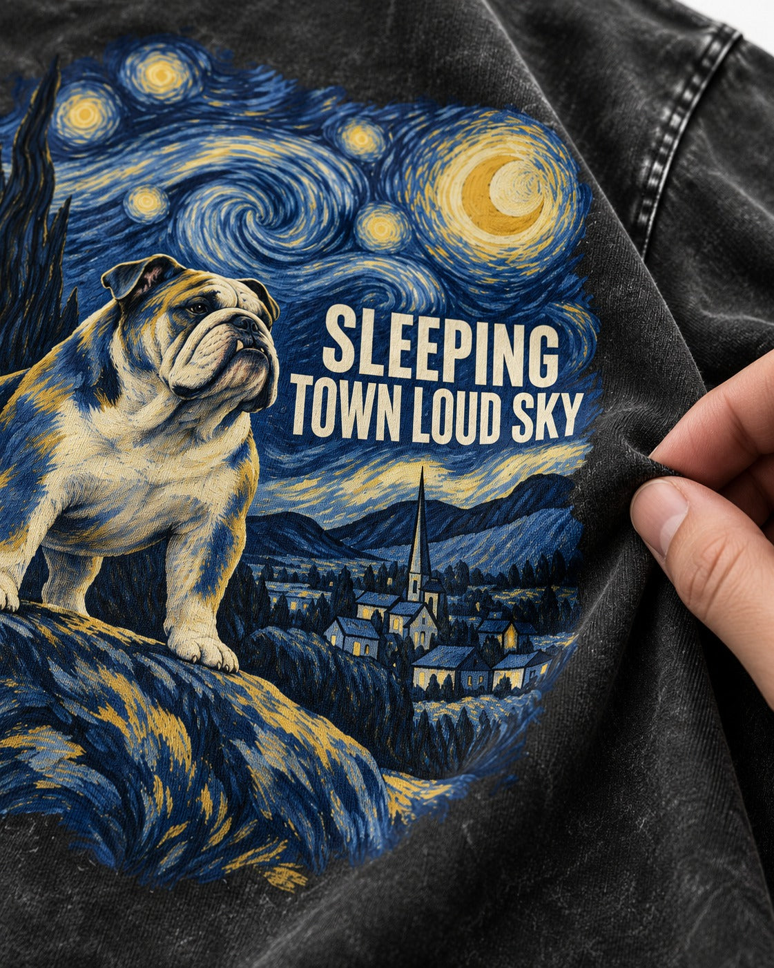 English Bulldog Sleeping Town Loud Sky Starry Night Graphic Washed Tee in Black, close-up of the graphic