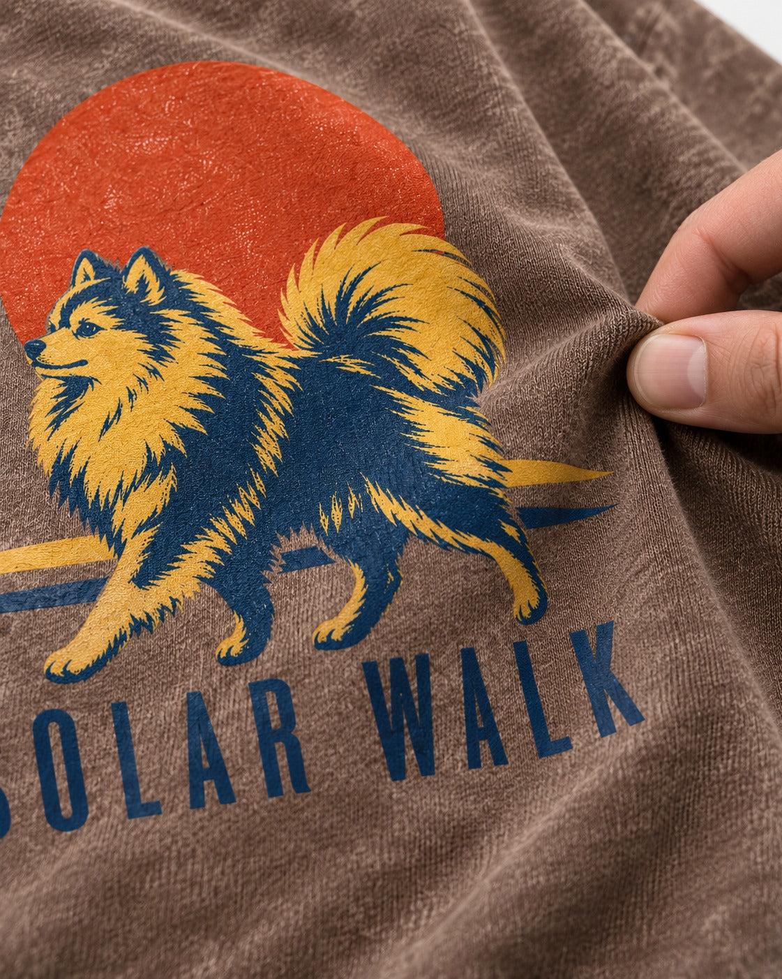 Pomeranian Solar Walk Washed Tee in Coffee, close-up of the graphic