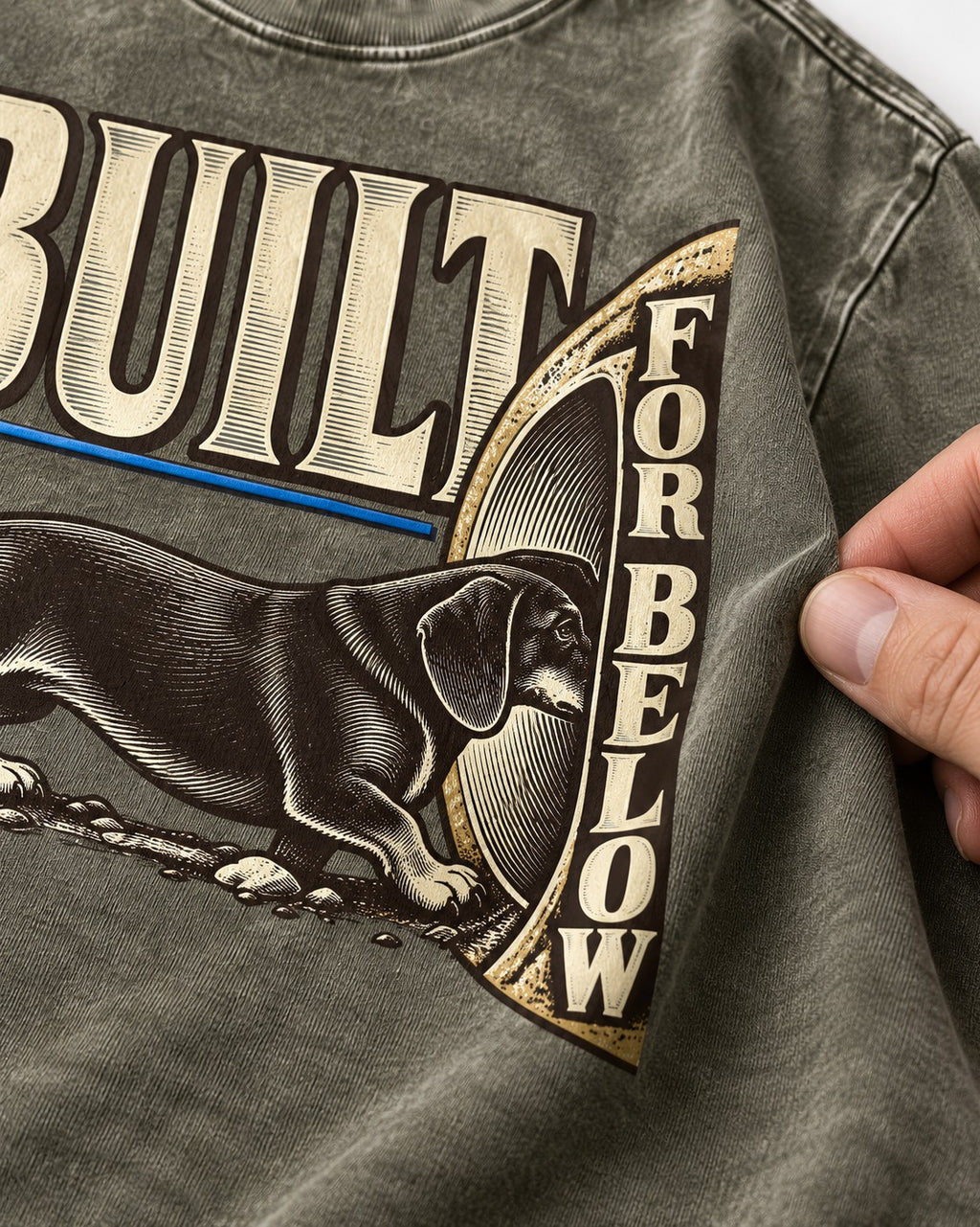 Dachshund Built for Below Vintage Burrow Graphic Washed Tee in Army Green, close-up of the graphic