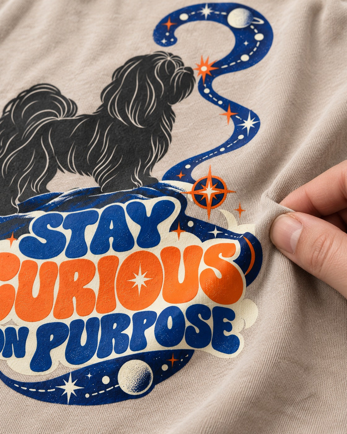 Stay Curious on Purpose Shih Tzu Washed Tee in Apricot, close-up of the graphic