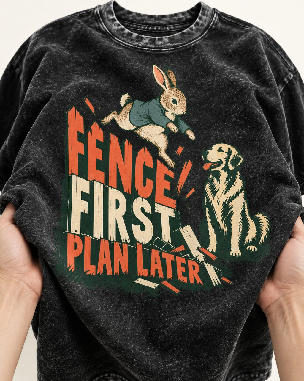 Golden Retriever Fence First Plan Later Rabbit Jump Graphic Washed Tee in Black, close-up of the graphic