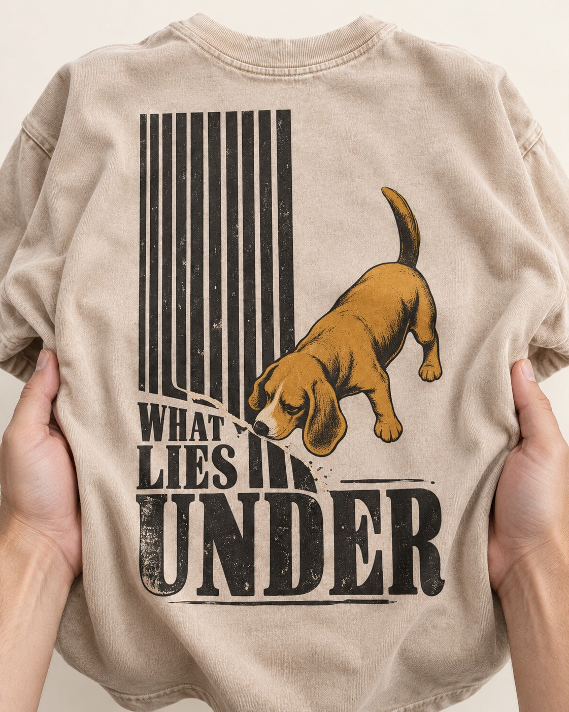 Beagle Knows What Lies Under Washed Tee in Apricot, close-up of the graphic