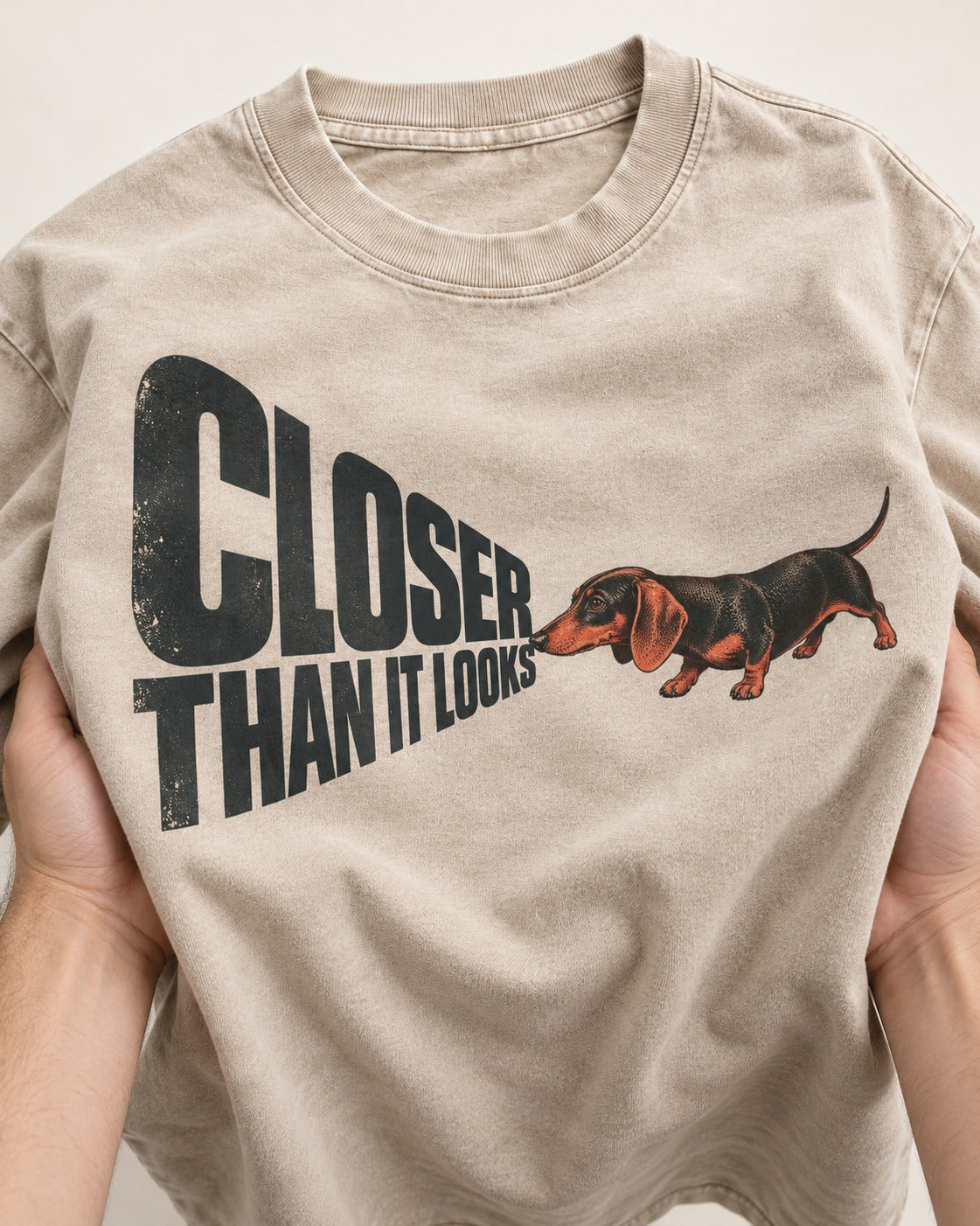 Dachshund Closer Than It Looks Washed Tee in Apricot, close-up of the graphic