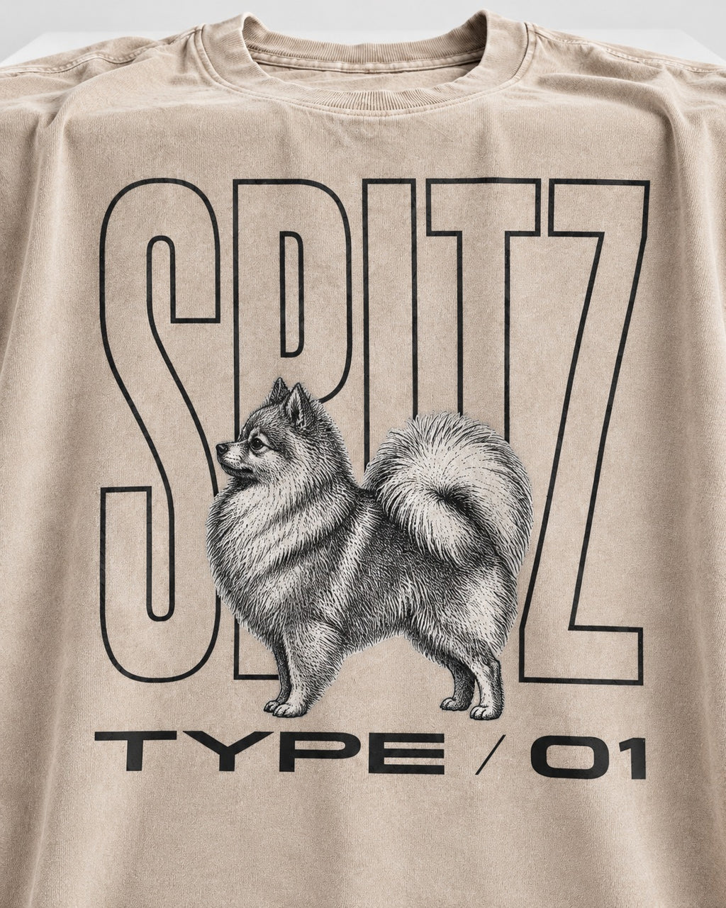 Pomeranian Spitz Washed Tee in Apricot, close-up of the graphic