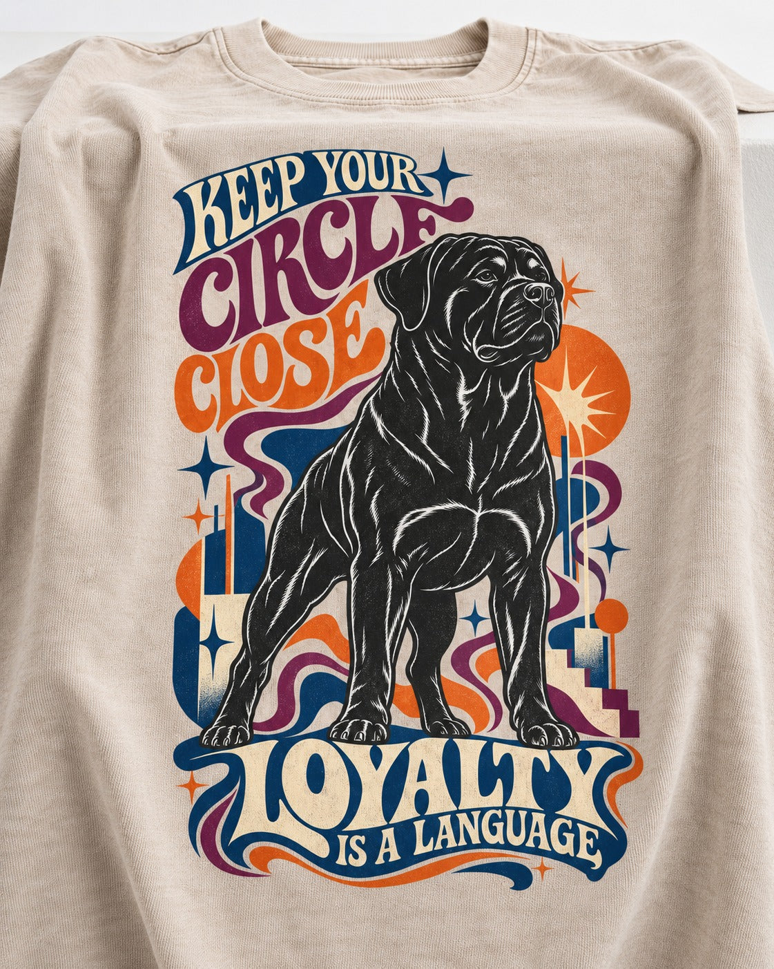 Keep Your Rottweiler Circle Close Washed Tee in Apricot, close-up of the graphic
