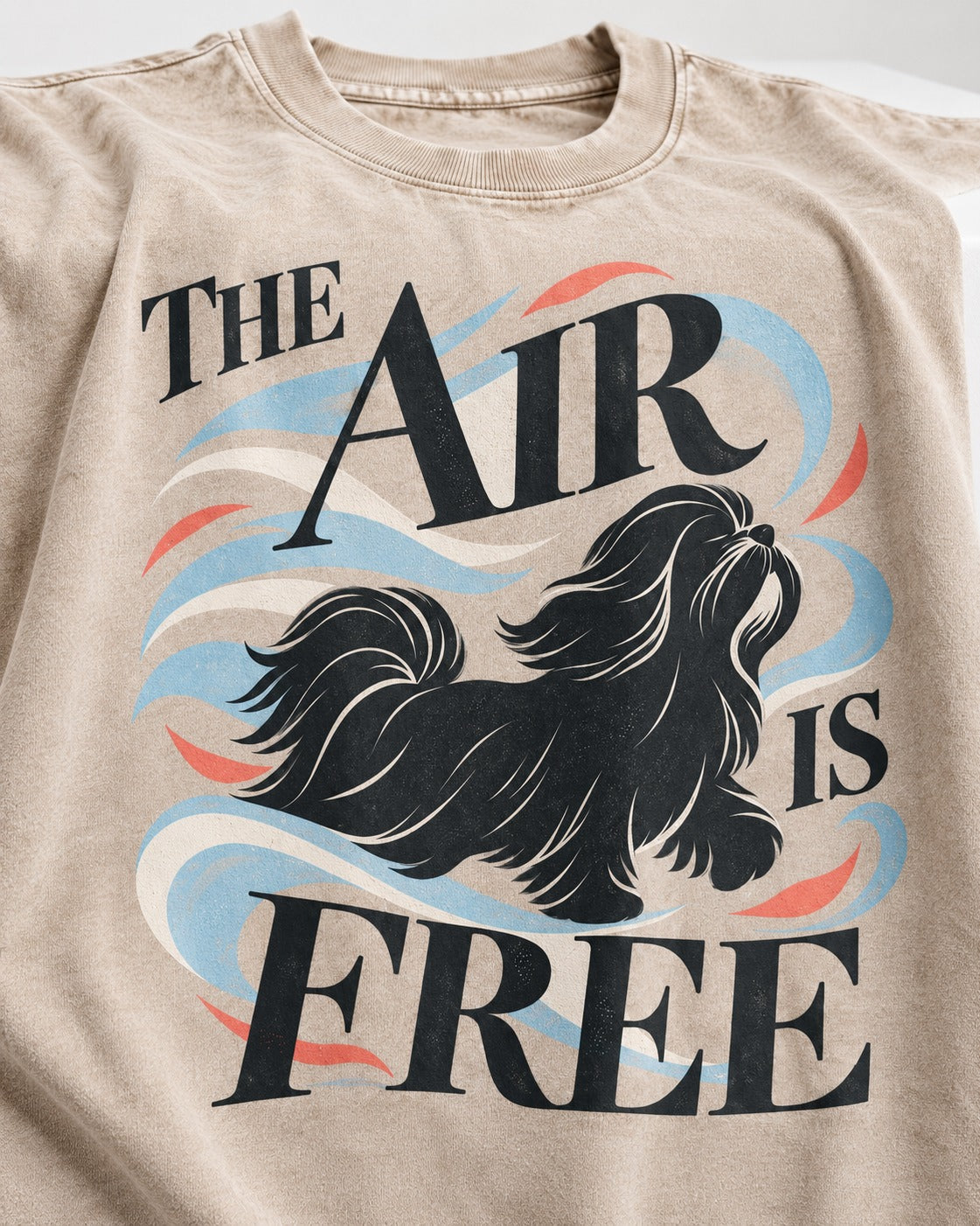 The Air Is Free Shih Tzu Washed Tee in Apricot, close-up of the graphic