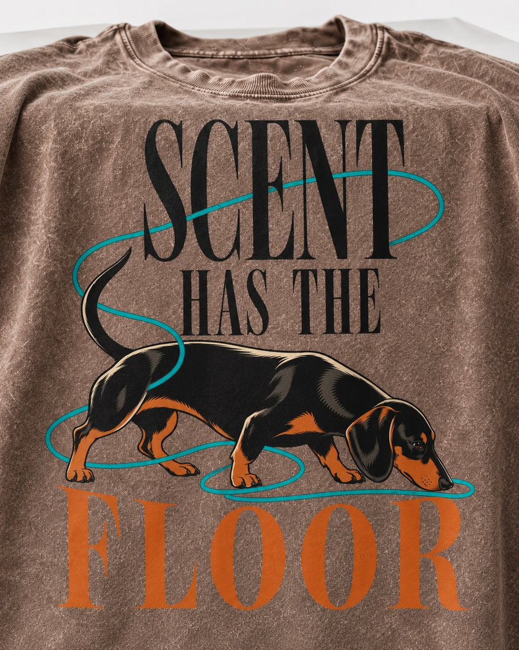 Dachshund Scent Has the Floor Washed Tee in Coffee, close-up of the graphic