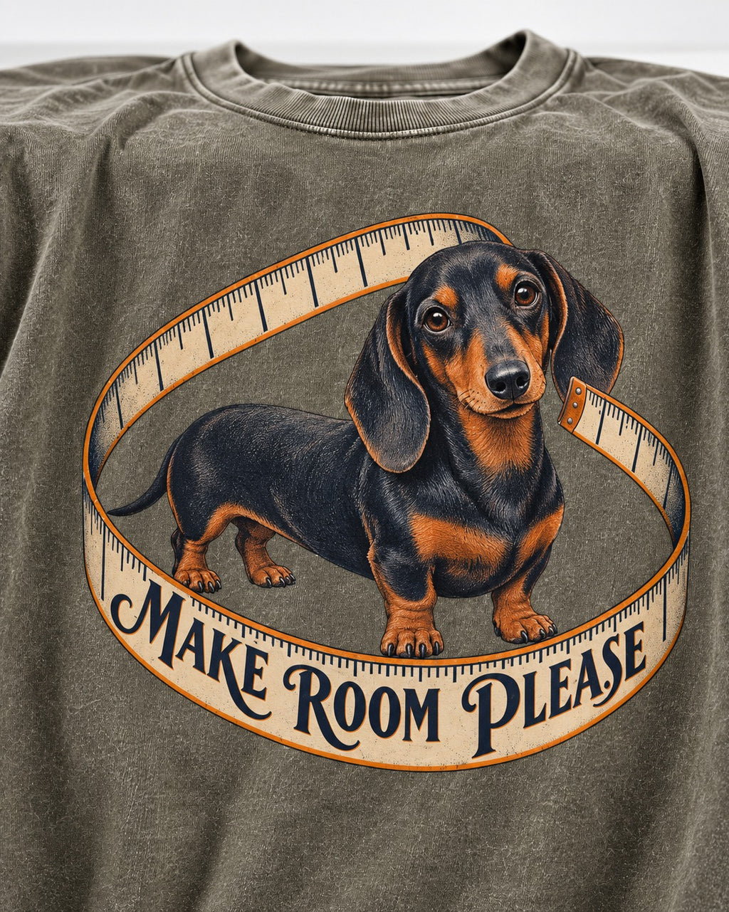 Dachshund Make Room Please Measuring Tape Graphic Washed Tee in Army Green, close-up of the graphic