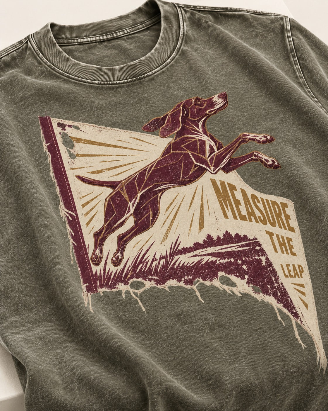 German Shorthaired Pointer Measure the Leap Torn Banner Graphic Washed Tee in Army Green, close-up of the graphic