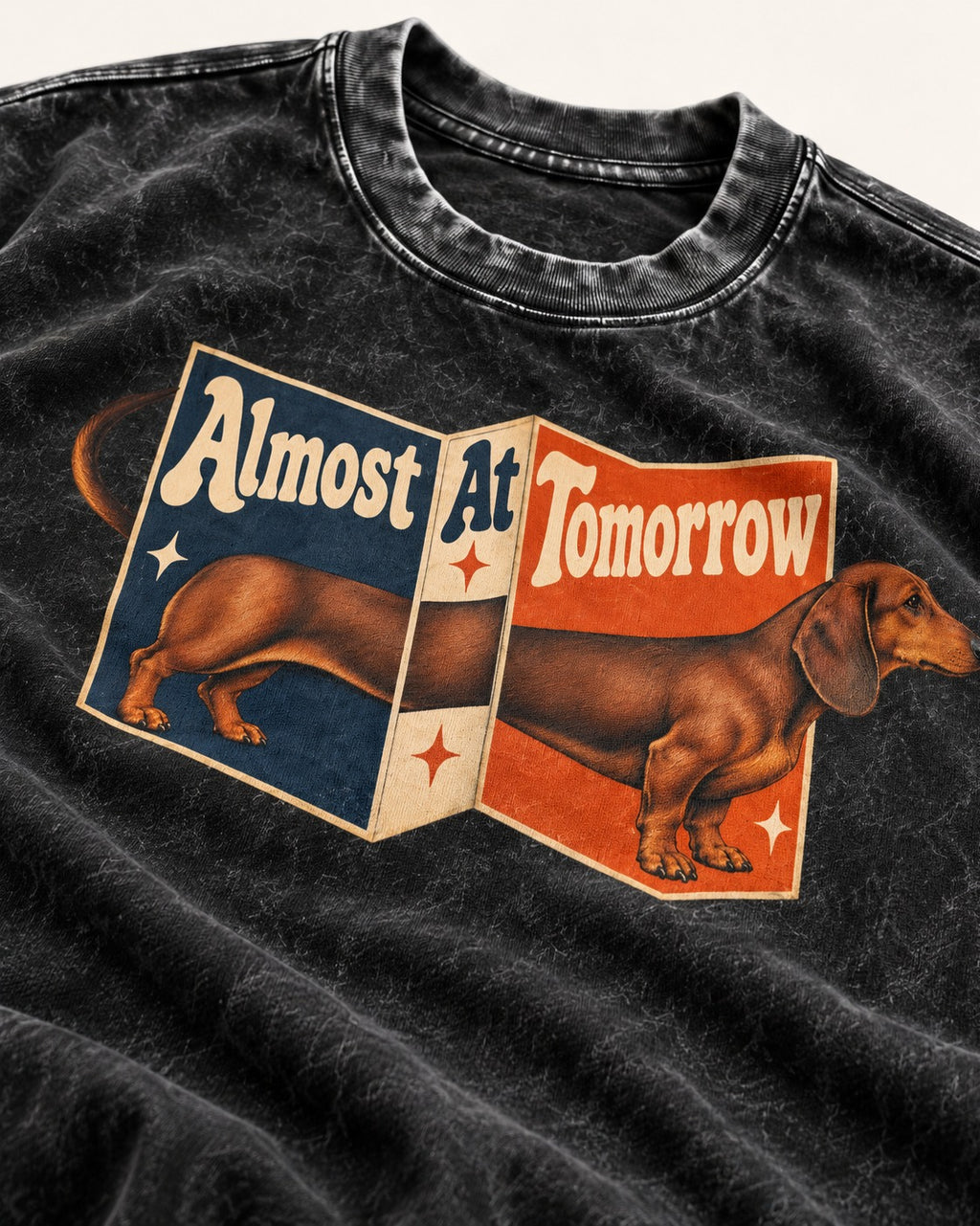 Dachshund Almost At Tomorrow Folding Screen Graphic Washed Tee in Black, close-up of the graphic