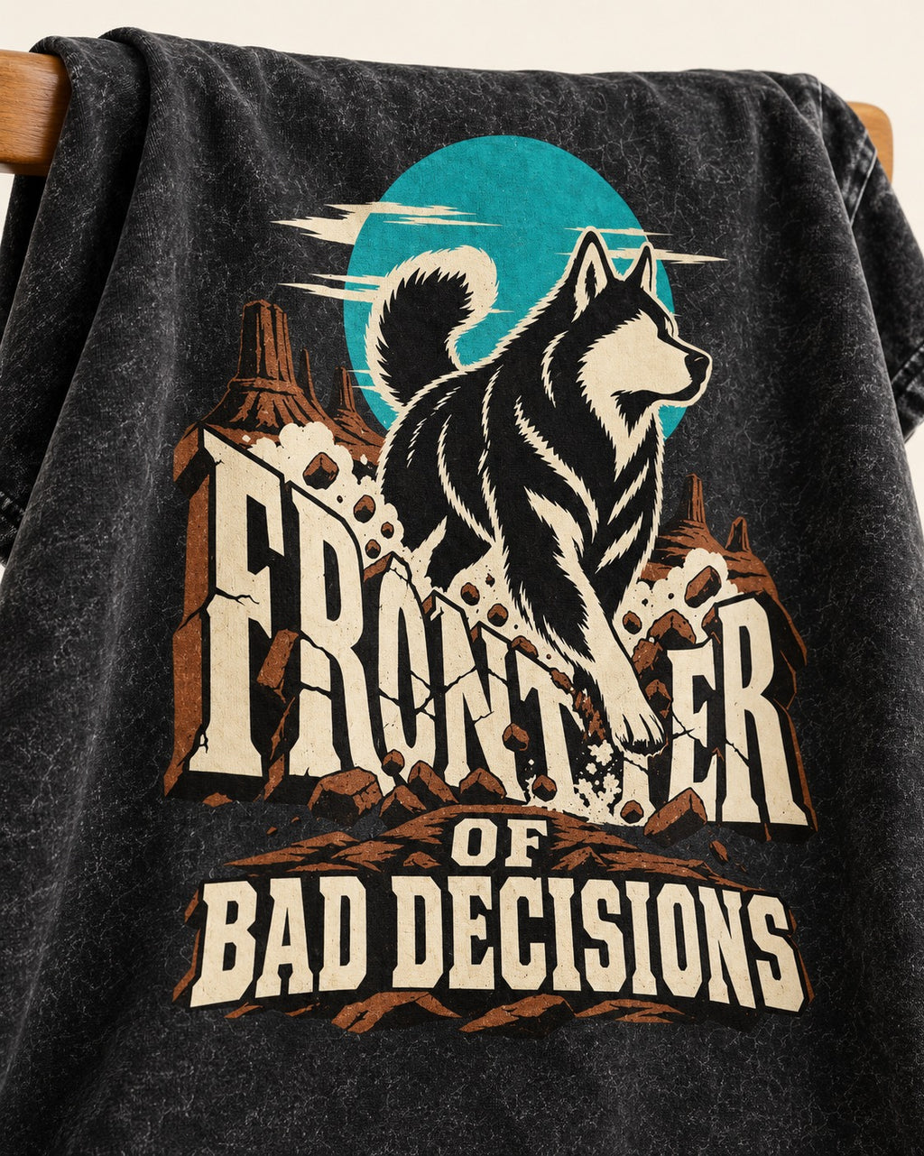 Husky Frontier of Bad Decisions Desert Graphic Washed Tee in Black, close-up of the graphic