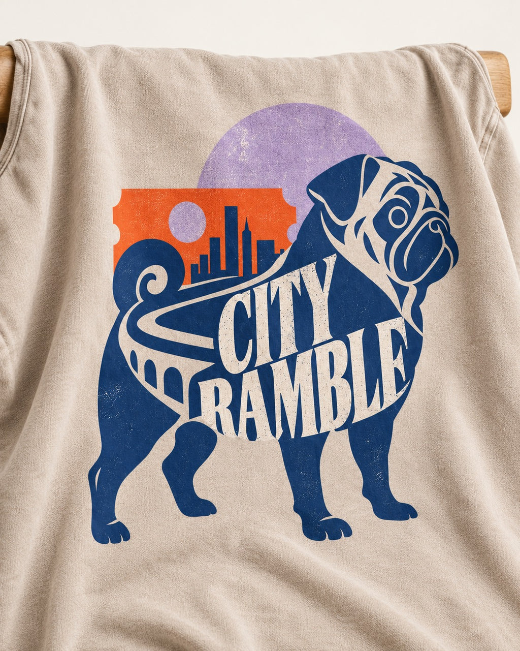 Pug's Big City Ramble Washed Tee in Apricot, close-up of the graphic