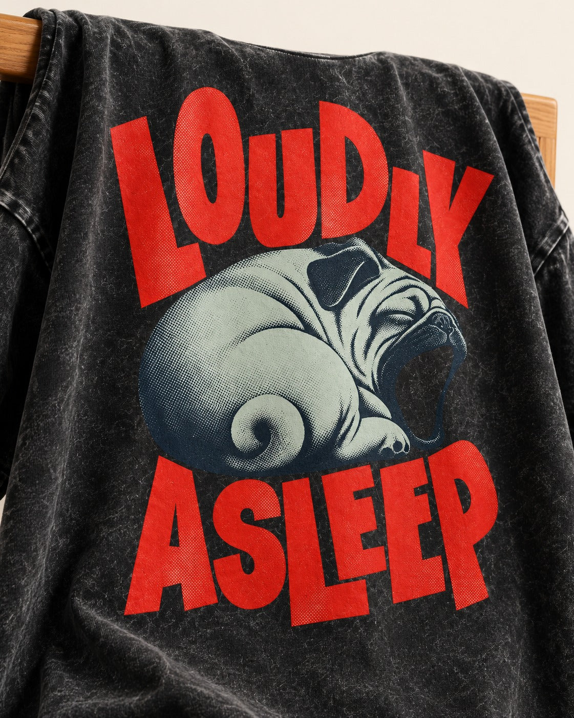 Pug Loudly Asleep Curled Yawn Graphic Washed Tee in Black, close-up of the graphic