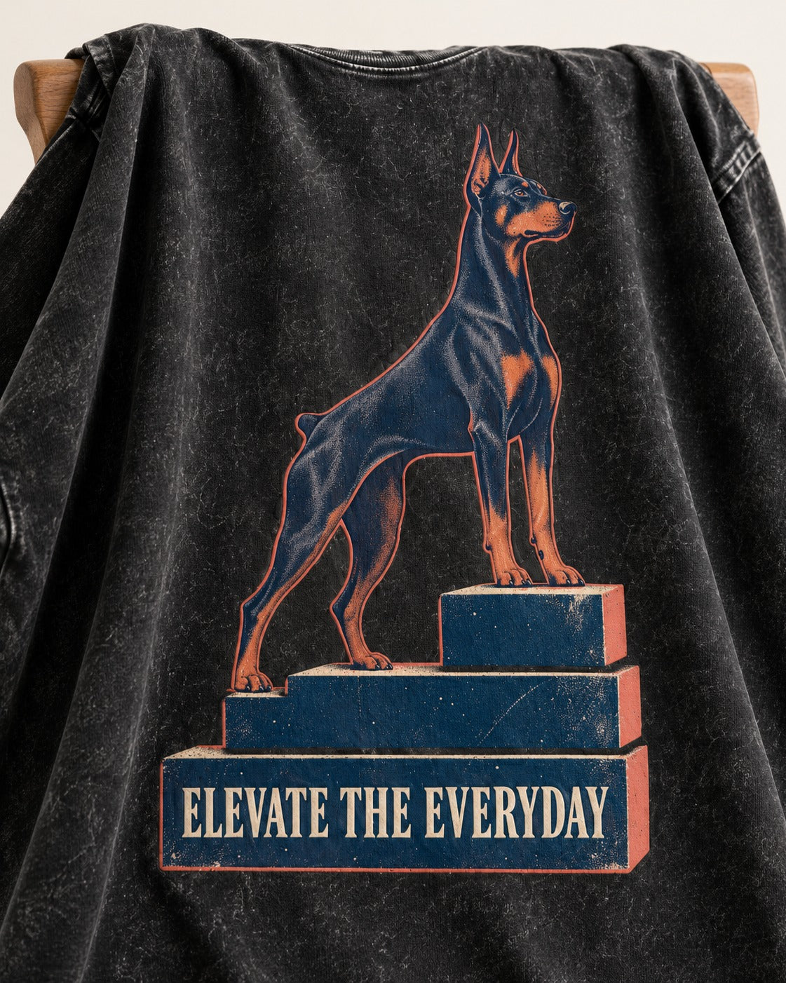 Doberman Elevate the Everyday Podium Graphic Washed Tee in Black, close-up of the graphic