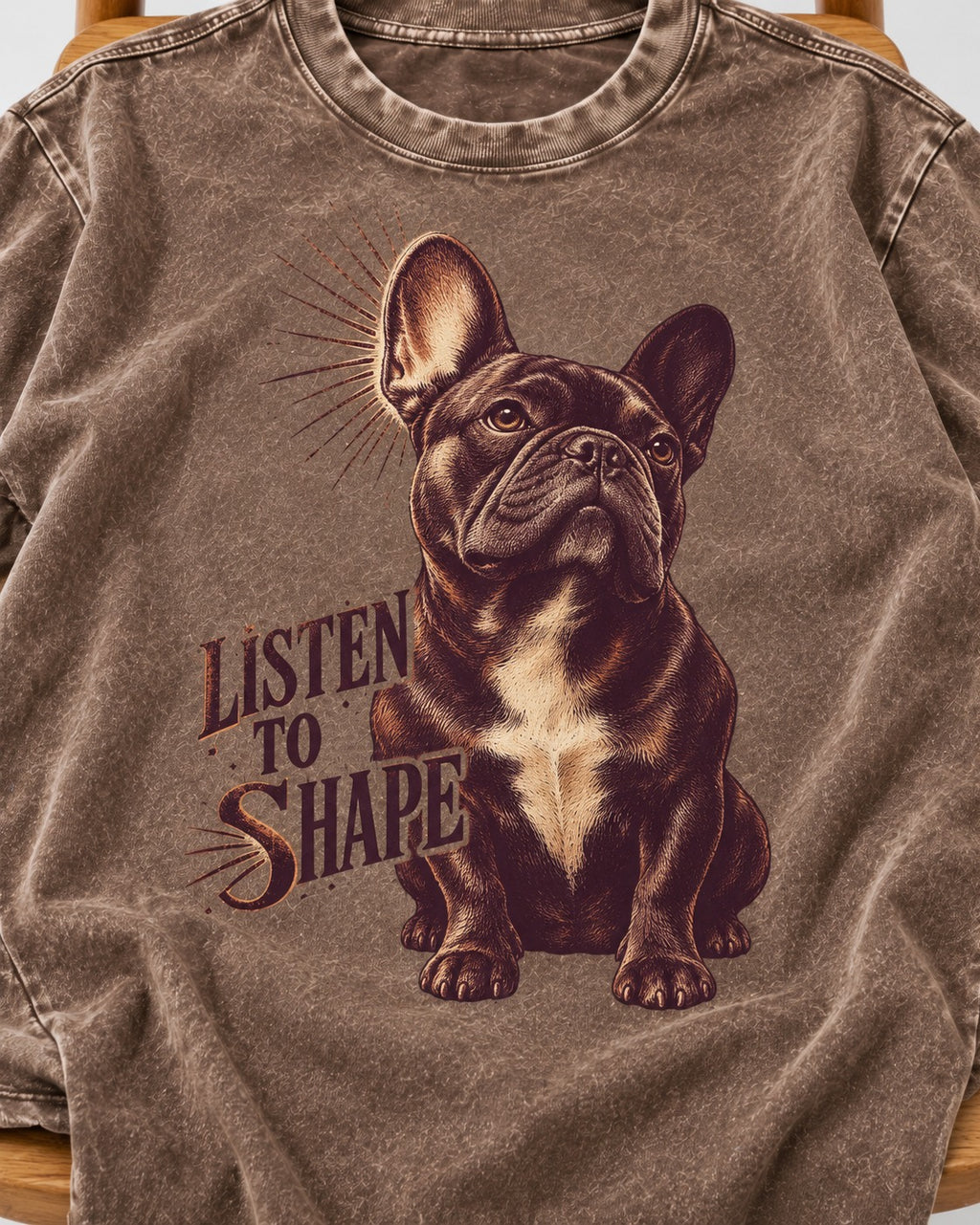 Listen to Shape Frenchie Washed Tee in Coffee, close-up of the graphic