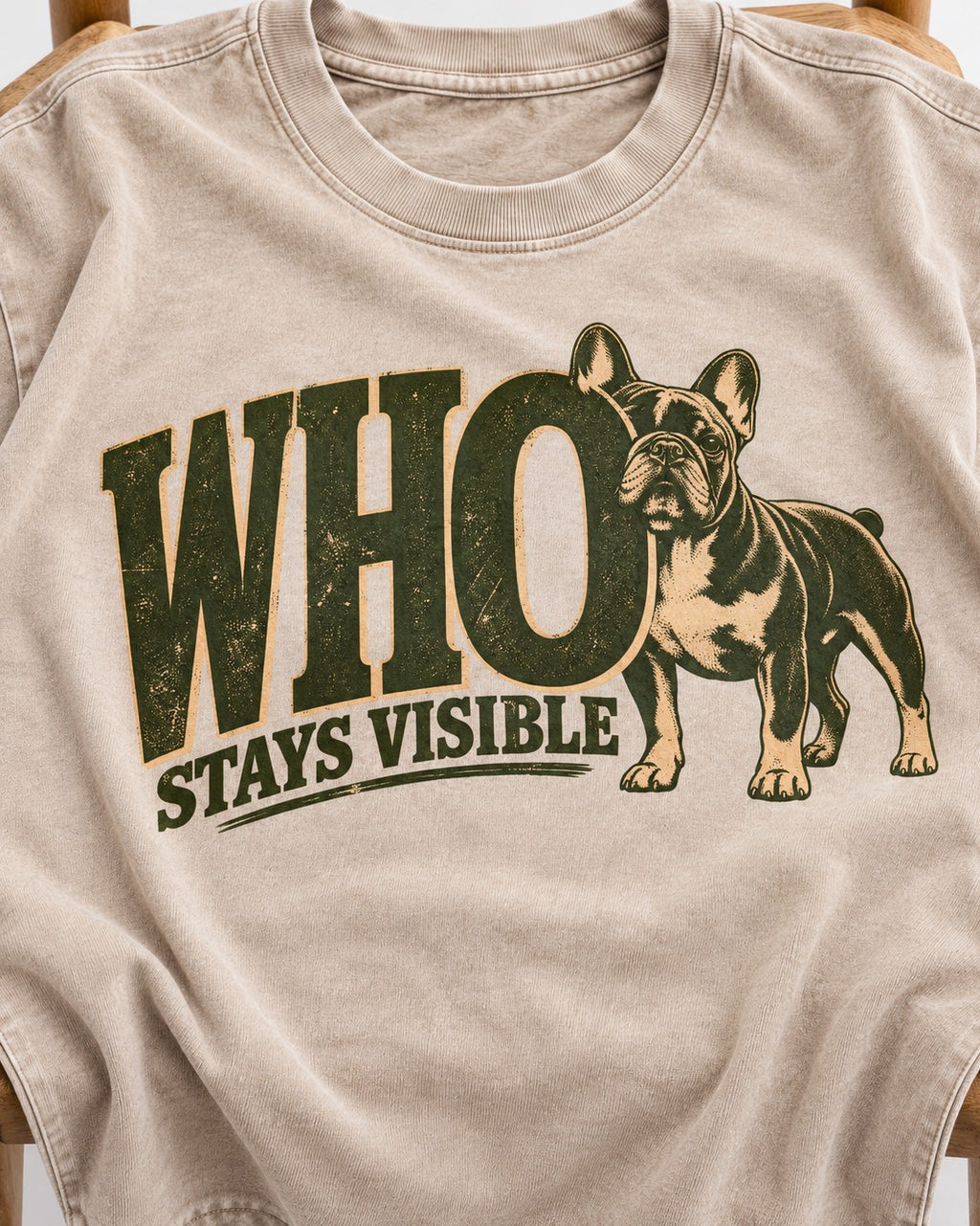 Frenchie Stays Visible Washed Tee in Apricot, close-up of the graphic