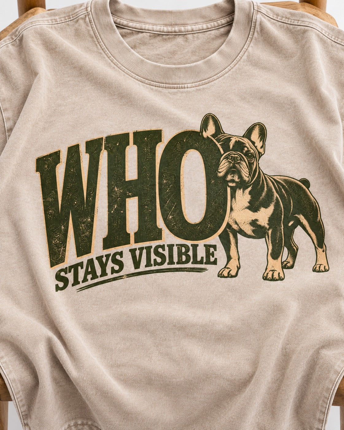 Frenchie Stays Visible Washed Tee in Apricot, close-up of the graphic