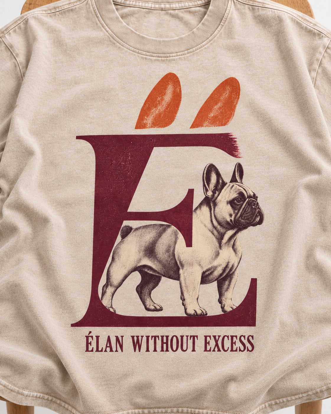 Frenchie Without Excess Washed Tee in Apricot, close-up of the graphic