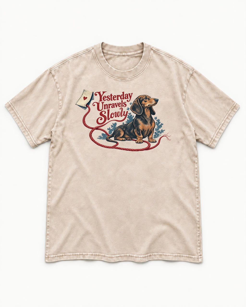 Yesterday Unravels Slowly with Dachshund Washed Tee in Apricot, flat lay product photo