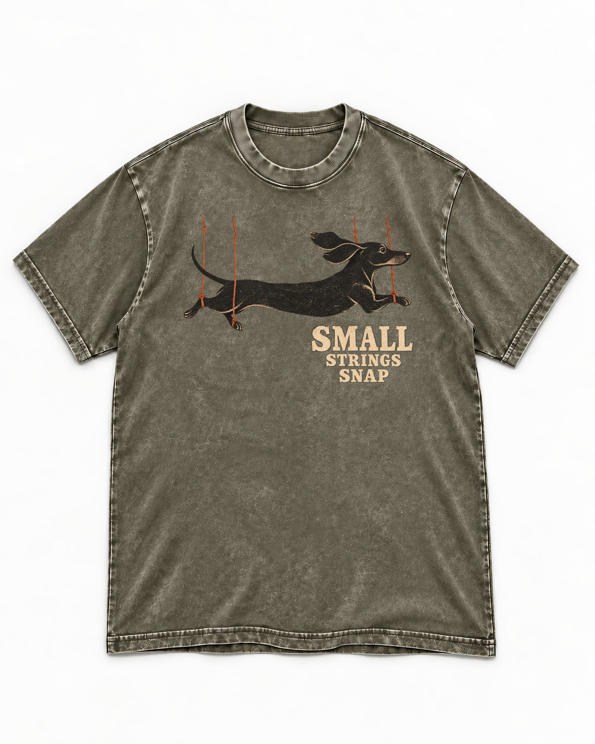 Dachshund Small Strings Snap Marionette Graphic Washed Tee in Army Green, flat lay product photo